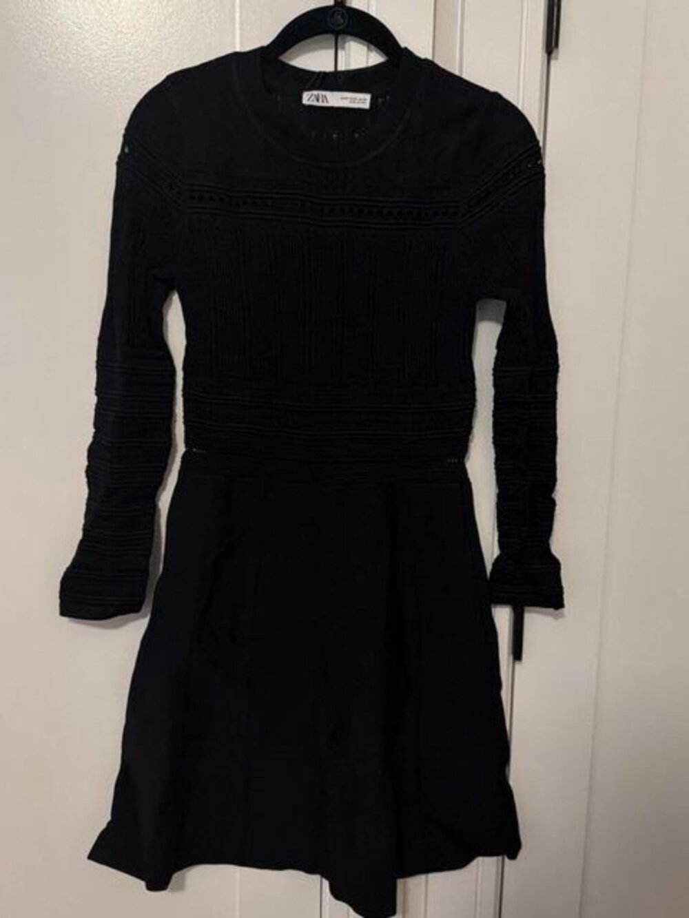 Zara black mini dress with textured ribbed detailing on the bodice and sleeves